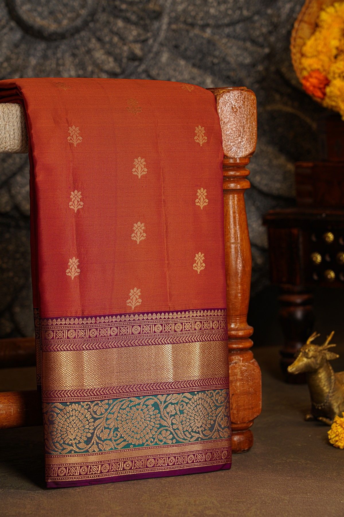 Kancheepuram Silk Rust Saree With Florals And Leaves With Cross Lines Border