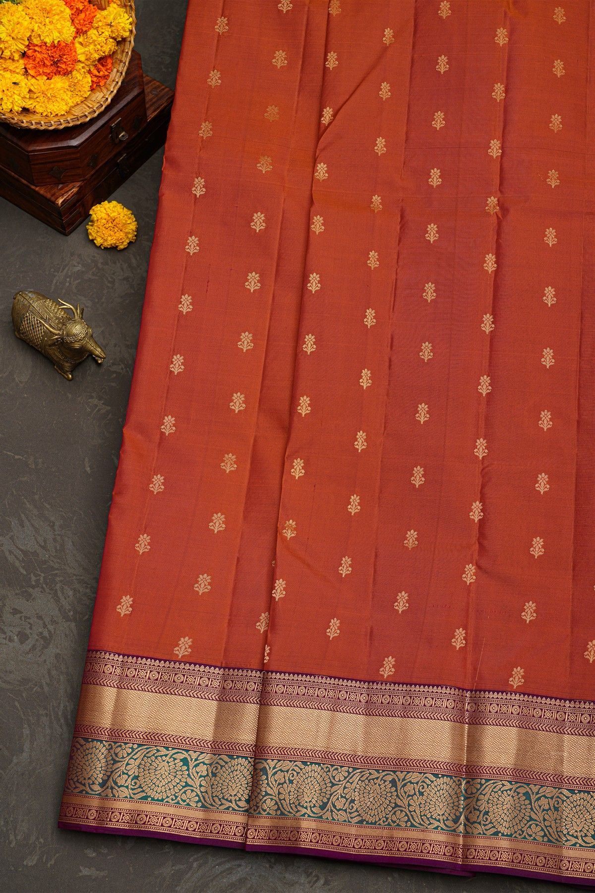 Kancheepuram Silk Rust Saree With Florals And Leaves With Cross Lines Border