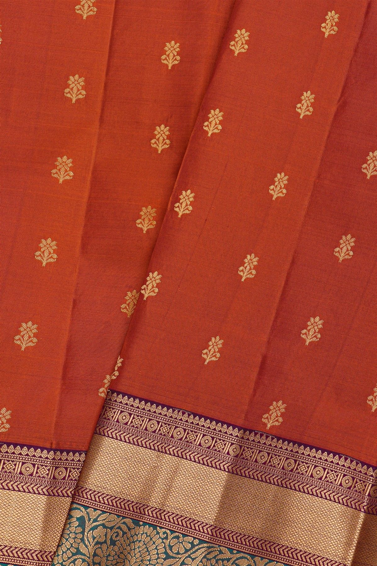 Kancheepuram Silk Rust Saree With Florals And Leaves With Cross Lines Border