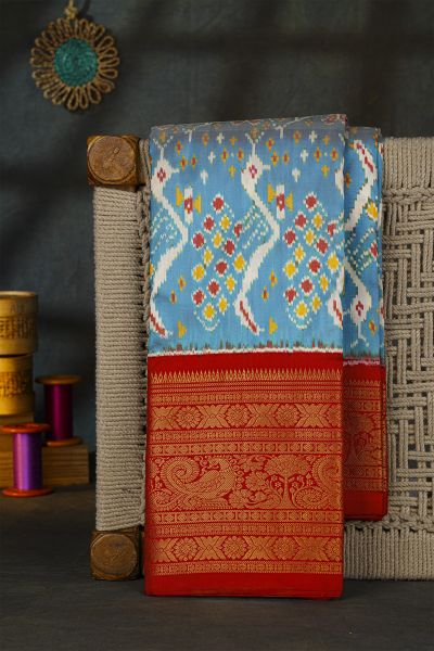 Pochampally Ikat Silk Sky Blue Saree With Floral And Peacock Border