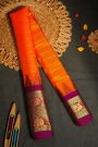 Gadwal Silk Orange Saree With Florals And Peacocks Border