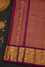 Gadwal Silk Orange Saree With Florals And Peacocks Border
