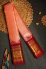 Gadwal Silk Peach Orange Saree With Floral And Peacock Border
