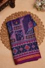 Patola Silk Dark Violet Saree With Florals And Leaves With Birds Body And Self Florals And Leaves Border