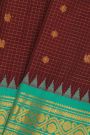 Gadwal Silk Maroon Saree With Florals And Peacocks In Zari Checks