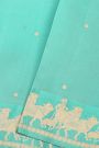 Fancy Matka Silk Sky Blue Saree With Floral Buttis Body And Pichwai Cows Motifs Border