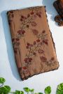 Designer Georgette Rust Saree With Weaves Design In Kardhana Work Border