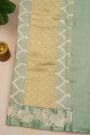 Fancy Matka Silk Sage Green Saree With Florals And Buttis Body And Self Florals And Leaves Border