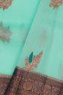 Fancy Organza Sky Blue Saree With Florals And Leaves In Zari Body And Contrast Florals And Leaves Jaal With Diamonds Border