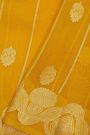 Fancy Organza Yellow Saree With Florals And Buttis Body And Self Florals And Leaves Border