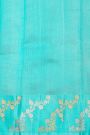 Fancy Matka Silk Peacock Blue Saree With Florals And Buttis Body And Contrast Florals And Leaves Border