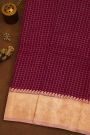 Fancy Organza Wine Saree With Checks Body And Contrast Florals And Leaves Border