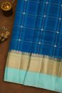 Fancy Organza Royal Blue Saree With Checks And Florals Body And Contrast Florals And Leaves Border