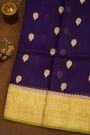 Fancy Organza Purple Saree With Florals And Buttis Body And Contrast Florals And Leaves Border