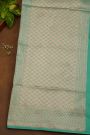 Banarasi Silk Sea Green Saree With Florals And Leaves Border