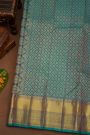 Kancheepuram Pure Silk Teal Blue Saree With Body Florals And Leaves Jaal With Zari Border