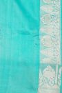 Fancy Matka Silk Peacock Blue Saree With Florals And Buttis Body And Contrast Florals And Leaves Border