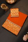 Fancy Crepe Orange Saree With All Over Plain Body And Self Design Florals And Leaves In Zari Border
