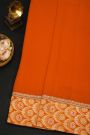 Fancy Crepe Orange Saree With All Over Plain Body And Self Design Florals And Leaves In Zari Border
