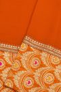 Fancy Crepe Orange Saree With All Over Plain Body And Self Design Florals And Leaves In Zari Border