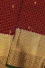 Kancheepuram Silk Maroon Saree With Florals And Leaves In Zari Checks Body And Traditional Kaddi Border