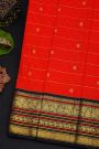 Kancheepuram Silk Orange Saree With Contrast Florals And Peacocks Border