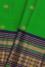 Kancheepuram Silk Parrot Green Saree With Buttis And Zari Lines Body