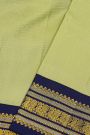 Kancheepuram Silk Lime Green Saree With Contrast Florals And Peacocks Border