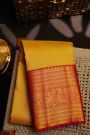 Kancheepuram Silk Yellow Saree With Florals And Leaves Border