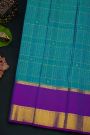 Kancheepuram Silk Blue Saree With Florals And Peacocks In Zari Checks