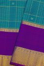 Kancheepuram Silk Blue Saree With Florals And Peacocks In Zari Checks