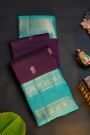 Kancheepuram Silk Wine Saree With Florals And Leaves In Zari Body Gap Border