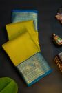 Kancheepuram Silk Mehendi Green Saree With Checks Design Peacocks Border
