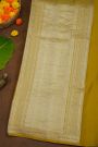 Banarasi Silk Mustard Saree With Zari Lines Body And Self Florals And Leaves Border