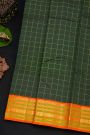 Kancheepuram Silk Bottle Green Saree With Zari Checks Body And Contrast Florals And Peacocks Border