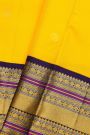 Kancheepuram Silk Yellow Saree With Gold Buttas And Peacock And Elephant Motif Kaddi Zari Border