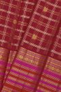 Kancheepuram Silk Maroon Saree With Florals And Peacocks In Checks Body And Self Zig-Zag Lines And Florals Border