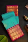 Kancheepuram Silk Sky Blue Saree With Florals And Buttis Body And Contrast Florals And Buttis Border