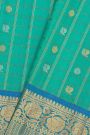 Gadwal Silk Sea Blue Saree With Florals And Peacocks In Zari Checks Body