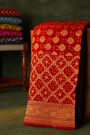 Bandhani Kaddi Georgette Red Saree With Florals And Bandhani Dots Body