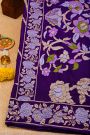 Banarasi Georgette Dark Purple Saree With Florals And Leaves Border