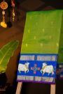 Gadwal Silk Green Saree With Tanjore Hand Painted Florals And Pichwai Cows Border