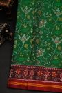 Patola Silk Green Saree With All Over Jaals And Leaf Lines Border