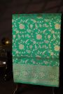 Banarasi Silk Sea Green Saree With Floral And Leaf Jaal Body