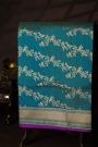 Banarasi Silk Peacock Blue Saree With Cross Lines In Zari Border