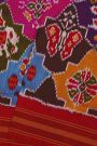 Ikat Silk Multi Colour Saree With Floral Motifs And Red Striped Border