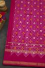 Pochampally Ikat Silk Rani Pink Saree With Floral And Leaf Jaal Border