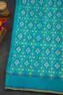 Ikat Silk Turquoise Blue Saree With Checks Body