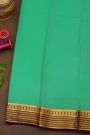Mysore Crepe Sea Green Saree With Florals And Zari Lines Border