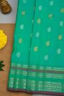 Gadwal Silk Rama Green Saree With Florals And Buttis Border
